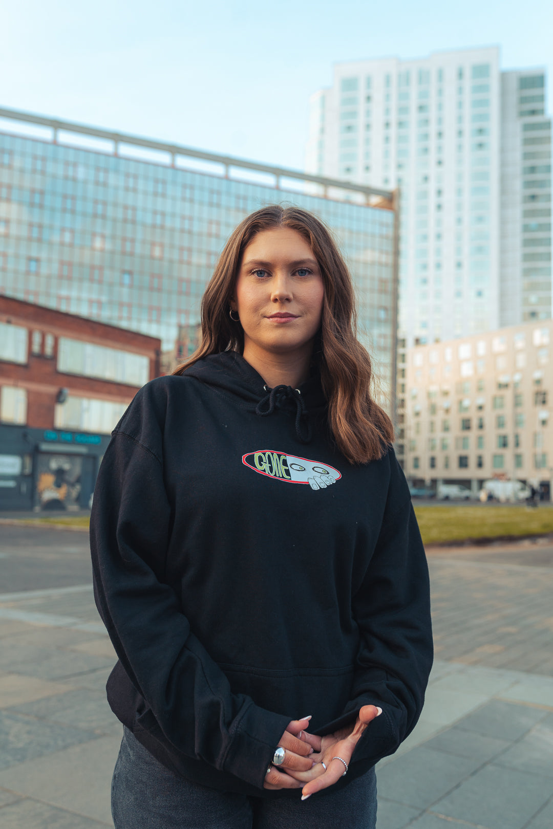 woman wearing black graphic hooded sweatshirt