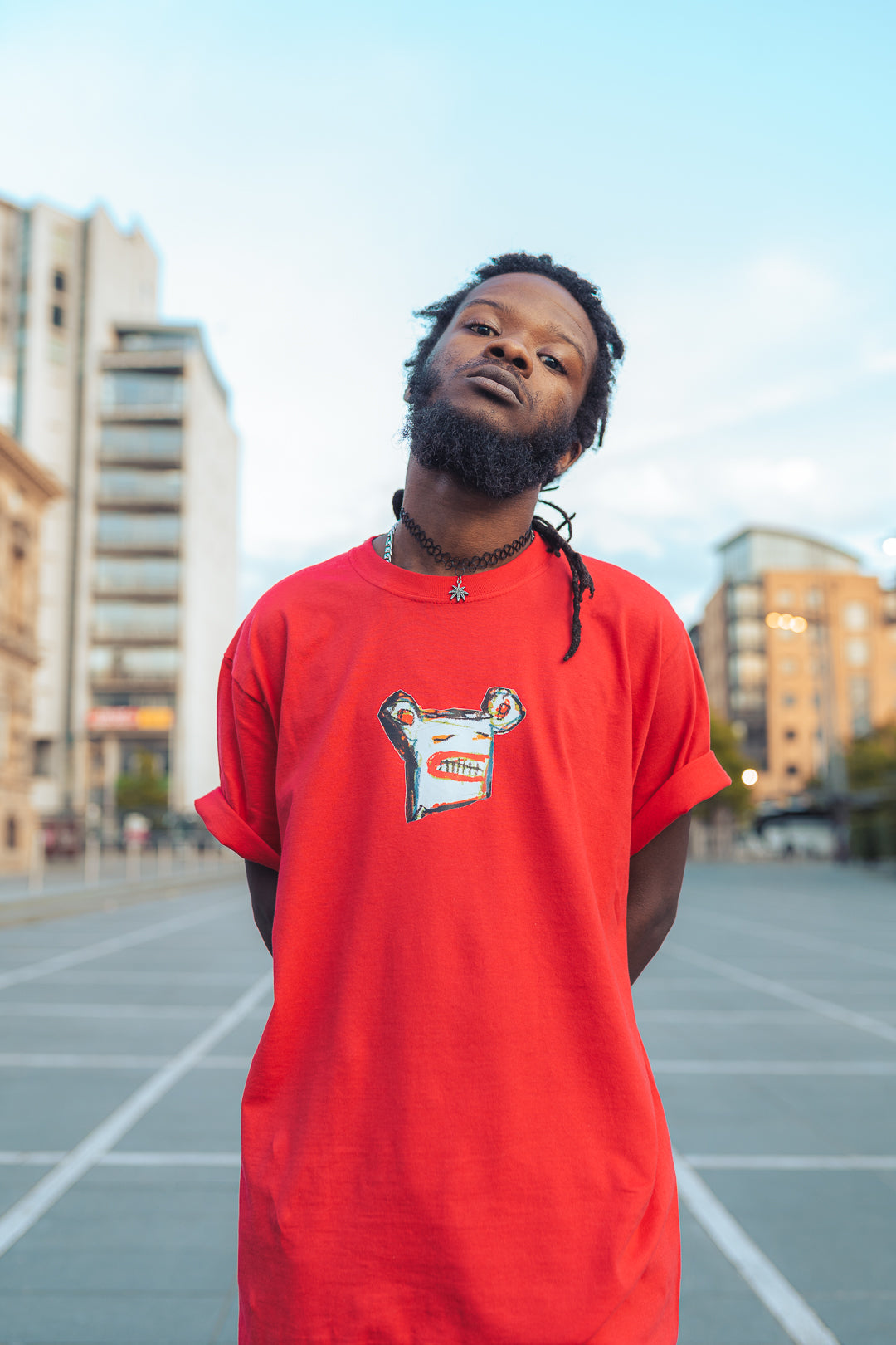 man in red graphic t-shirt