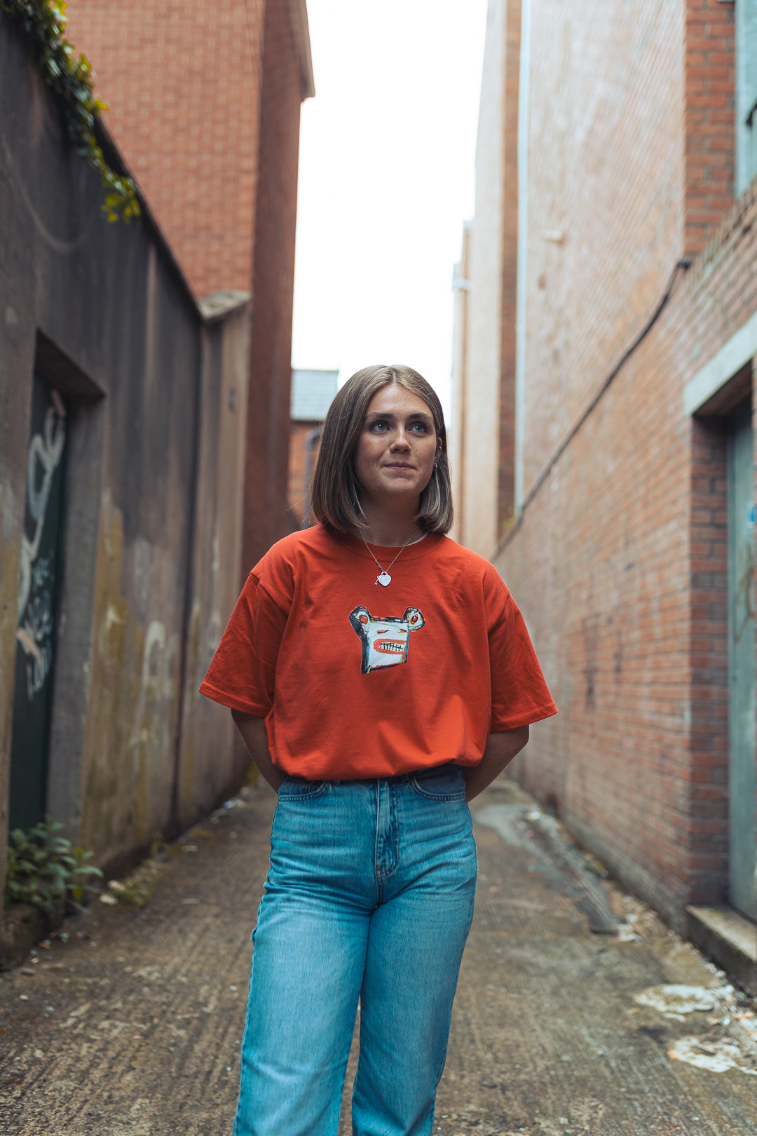 woman in red graphic t-shirt